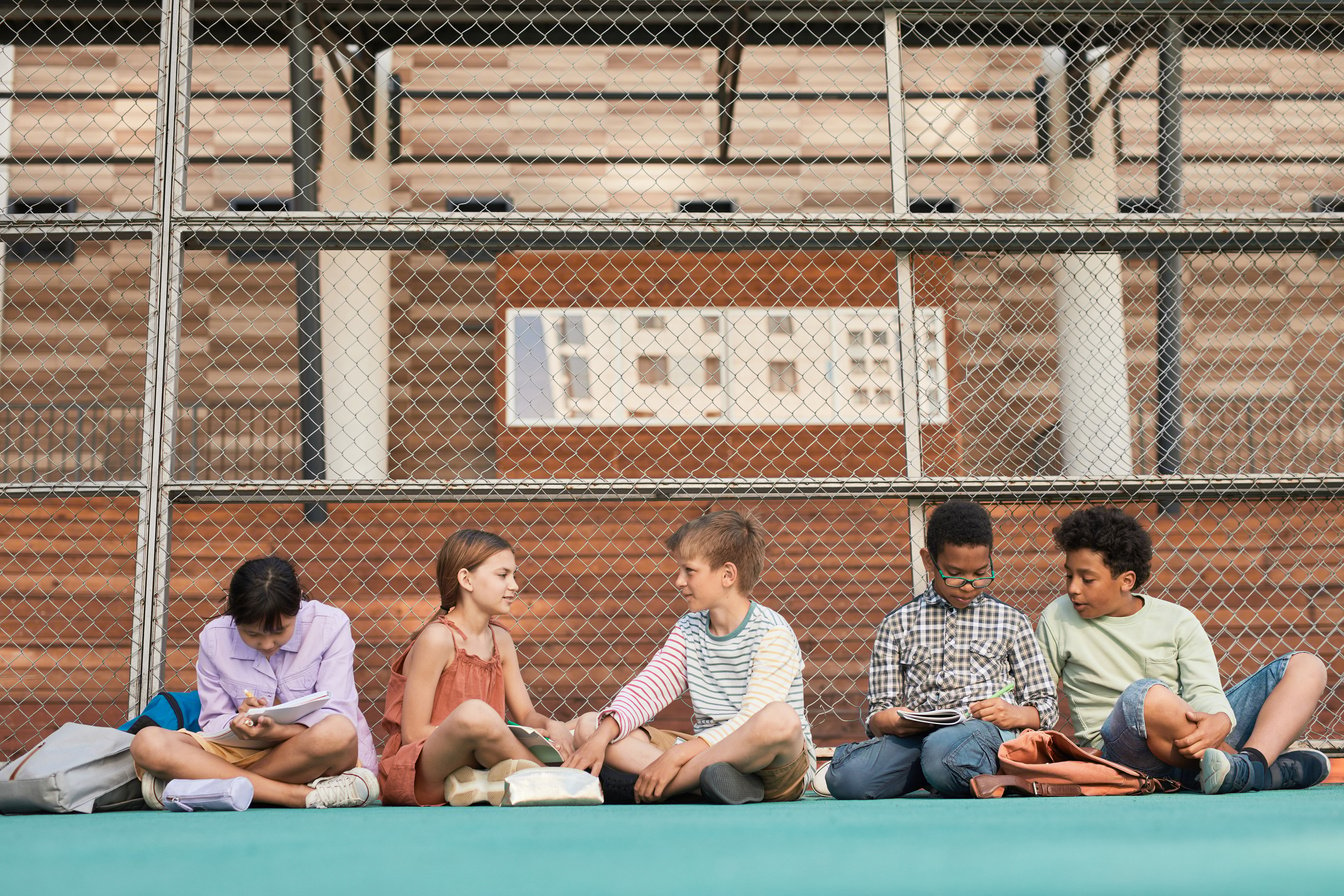 Children Studying on the Playground